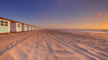 Row of beach huts at sunset, Texel island, The Netherlands
