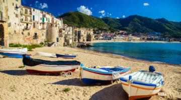 Old beach in Cefalu with fishing boats