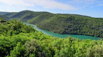 Green Hills and Jade Colored River in Istria Region of Croatia on a Sunny Day