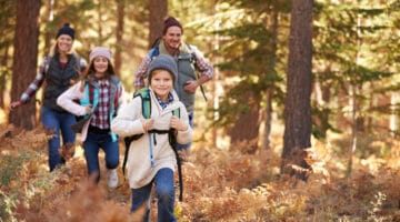 Family enjoying hike in a forest, California, USA