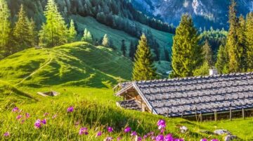 Idyllic landscape in the Alps with mountain chalet in springtime